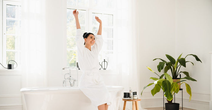 A Woman Excited to Upgrade to a Shower Head With Handheld Combo