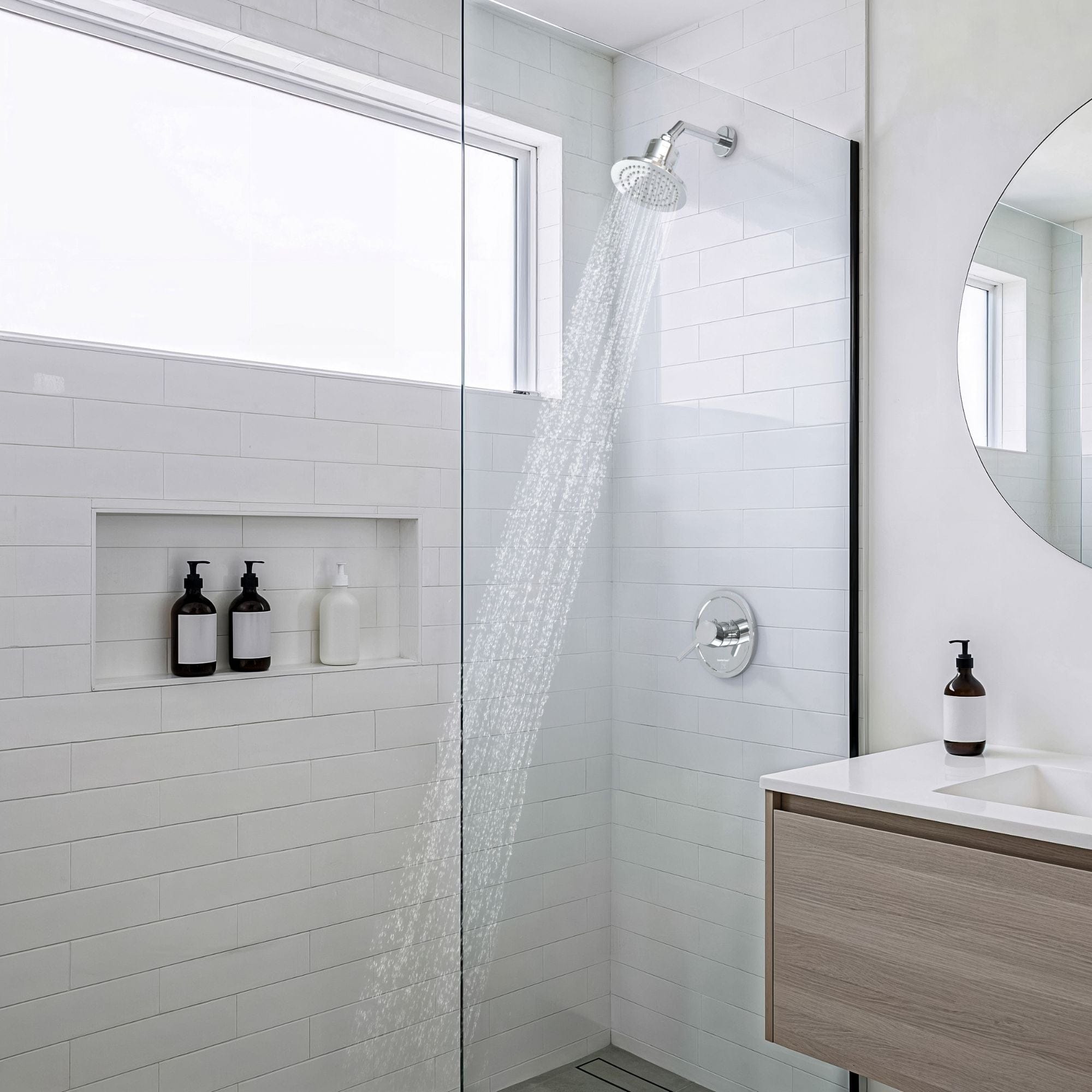 Gillian Filtered Shower Head in Lifestyle Setting with Water Spraying